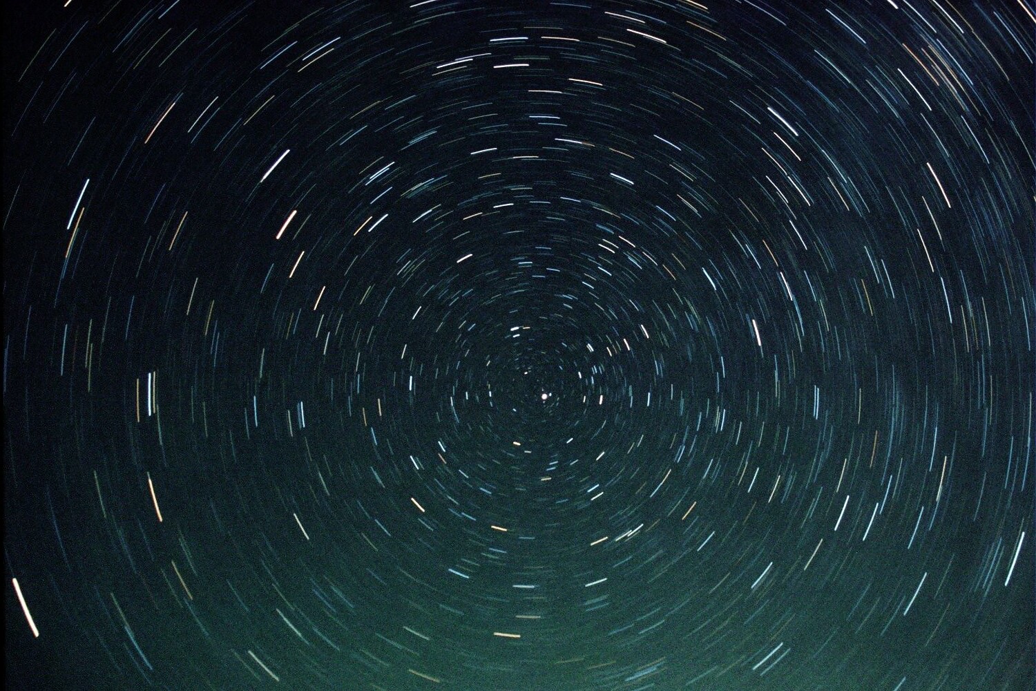 A long film exposure of circumpolar star trails wheeling around Polaris, shot from Anza-Borrego Desert State Park.